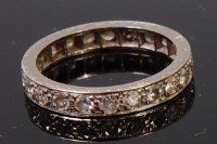 Lot 1191 - An 18ct white gold and diamond eternity ring,...
