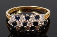 Lot 1193 - A contemporary 18ct gold, sapphire and diamond...