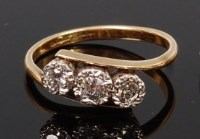 Lot 1194 - A vintage 18ct gold and diamond three stone...