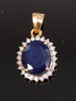 Lot 1212 - A modern 14ct gold, kashmir sapphire and...