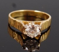 Lot 1223 - A modern 18ct gold diamond solitaire ring, the...