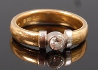 Lot 1227 - An 18ct gold diamond solitaire ring, the...