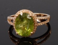 Lot 1249 - A contemporary 14ct yellow gold, green peridot...