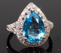 Lot 1251 - A contemporary 14ct white gold, blue topaz and...