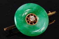 Lot 1270 - A yellow metal, jade and diamond set bar...