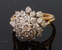 Lot 1277 - An 18ct gold and diamond flower head cluster...