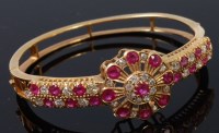 Lot 1286 - A yellow metal, ruby and diamond set hinged...