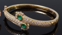 Lot 1287 - A modern ladies yellow metal, emerald and...