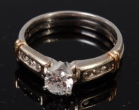 Lot 1299 - A platinum diamond solitaire ring, the four...