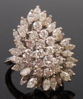 Lot 1301 - A 14ct white gold and diamond cocktail ring,...