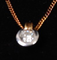 Lot 1311 - A diamond collet pendant on neck chain, the...