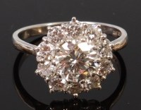 Lot 1319 - An 18ct white gold and platinum diamond flower...