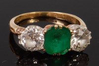 Lot 1320 - An 18ct gold, emerald and diamond ring, the...