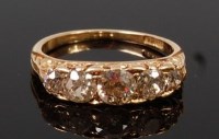 Lot 1325 - An 18ct gold and diamond five stone ring, the...