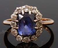 Lot 1342 - An 18ct gold, sapphire and diamond cluster...