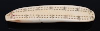 Lot 1362 - A 19th century whale-tooth cribbage scorer,...