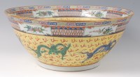 Lot 1391 - A Chinese porcelain punch bowl, 20th century,...