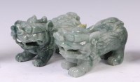 Lot 1395 - A pair of Chinese carved jade temple lions,...