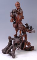 Lot 1412 - A Chinese root carving as a street vendor...