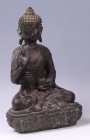 Lot 1419 - A Chinese bronze Buddha, seated upon a lotus...