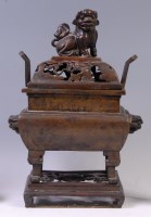 Lot 1420 - A Chinese bronze koro and cover on stand, the...