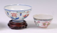 Lot 1423 - A Chinese porcelain tea bowl, decorated with...