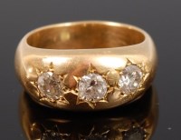 Lot 1234 - A gents heavy 18ct gold and three diamond set...