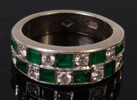 Lot 1300 - A 14ct white gold, emerald and diamond set...