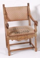 Lot 1540 - A 19th century carved limed oak elbow chair,...