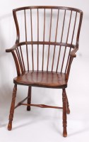 Lot 1541 - A circa 1900 stained beech comb-back farmhouse...