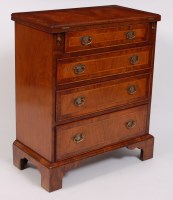 Lot 1550 - A walnut and figured walnut bachelors chest,...