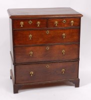 Lot 1567 - An 18th century oak chest, having two short...