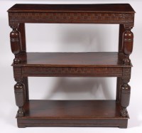 Lot 1580 - A 19th century oak three tier buffet, having...