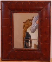 Lot 1596 - An oyster veneered cushion framed wall mirror...