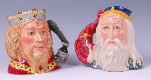 Lot 40 - Two Royal Doulton character jugs; 'King Arthur'...