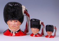 Lot 61 - A trio of graduated Royal Doulton character...