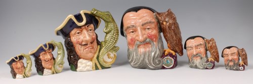 Lot 74 - A trio of graduated Royal Doulton character...