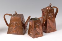 Lot 240 - A Newlyn copper three piece tea and coffer set,...