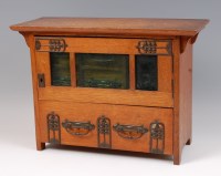 Lot 245 - An Arts & Crafts oak and stylised copper...