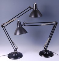 Lot 254 - A pair of contemporary black painted...