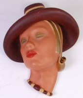 Lot 171 - An Art Deco painted plaster wall mask, of a...