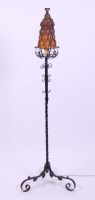 Lot 406 - An Arts & Crafts wrought iron standard lamp,...