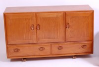 Lot 420 - An Ercol blond elm three door sideboard,...