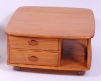 Lot 423 - An Ercol blond elm 'Pandora's box' coffee...