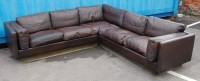 Lot 440 - A Danish chocolate brown leather corner sofa...