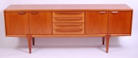 Lot 449 - A 1960s G-Plan teak long sideboard, having...