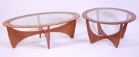 Lot 450 - A 1960s G-Plan teak and glass inset oval...