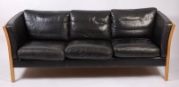 Lot 470 - A 1960s Danish beech framed and black leather...