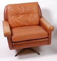 Lot 483 - A 1960s Danish tan leather swivel armchair by...