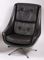 Lot 484 - A 1960s Danish black leather swivel bucket...